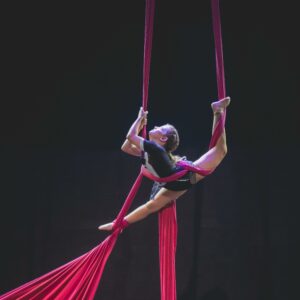 Dynamic aerial silk performance showcasing strength and grace in Brazil.